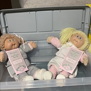 2 Cabbage Patch Kids Dolls with 5 extra sets of clothing